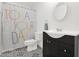 Bright bathroom featuring decorative tile floor, modern vanity, and upbeat shower curtain design at 14808 N 37Th Way, Phoenix, AZ 85032