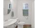 Well-lit bathroom with a sleek sink, toilet, and a large mirror at 14808 N 37Th Way, Phoenix, AZ 85032