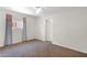 Bedroom features a neutral carpet, curtains, and a window for natural light at 14808 N 37Th Way, Phoenix, AZ 85032