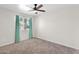 Carpeted bedroom with natural light from the window and ceiling fan at 14808 N 37Th Way, Phoenix, AZ 85032