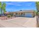 Single Gathering home with well-maintained driveway and desert landscaping, complemented by a convenient one-car garage at 14808 N 37Th Way, Phoenix, AZ 85032
