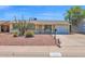 Charming home showcasing desert landscaping and a well-maintained front yard with an attached one-car garage at 14808 N 37Th Way, Phoenix, AZ 85032