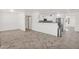 Open-concept space with new floors, connecting the living area to the kitchen and breakfast bar at 14808 N 37Th Way, Phoenix, AZ 85032