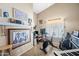 Versatile bonus room featuring a home office, workout area, and unique decor at 15194 W Vale Dr, Goodyear, AZ 85395