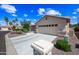 Lovely single-Gathering home with a well-kept lawn and a spacious driveway leading to the garage at 15194 W Vale Dr, Goodyear, AZ 85395