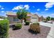 Charming single-story home featuring low-maintenance desert landscaping and a two-car garage at 15194 W Vale Dr, Goodyear, AZ 85395