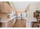 Bright kitchen with plenty of counter space, lots of cabinetry, and views to the living areas at 15194 W Vale Dr, Goodyear, AZ 85395