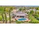 Backyard with a sparkling pool, a diving board, surrounded by lush landscaping, offering a private outdoor oasis at 1940 N Stevens Cir, Mesa, AZ 85205
