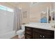 Bathroom featuring tile flooring, a vanity with storage, and a shower with a curtain at 1940 N Stevens Cir, Mesa, AZ 85205