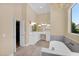 Bright main bathroom featuring a soaking tub, double vanity, and a walk in shower at 1940 N Stevens Cir, Mesa, AZ 85205