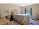 Cozy bedroom featuring a carved wood bed frame, a desk, and a comfortable chair at 1940 N Stevens Cir, Mesa, AZ 85205