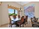 Comfortable dining area with desert views and large, decorative art at 1940 N Stevens Cir, Mesa, AZ 85205