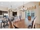 Open floor plan features an elegant dining area leading into the kitchen at 1940 N Stevens Cir, Mesa, AZ 85205
