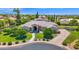 Expansive front yard featuring mature trees, lush landscaping, and a well-maintained lawn leading to the beautiful home at 1940 N Stevens Cir, Mesa, AZ 85205