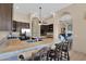 Spacious kitchen with granite countertops and bar stool seating at 1940 N Stevens Cir, Mesa, AZ 85205