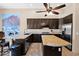 Gourmet kitchen with stainless steel appliances, center island, and ample counter space at 1940 N Stevens Cir, Mesa, AZ 85205
