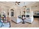 Bright and spacious living room with a fireplace, hardwood floors, comfortable seating, and elegant decor at 1940 N Stevens Cir, Mesa, AZ 85205