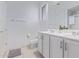 Bright bathroom with double sinks, white cabinetry, and a separate shower enhances this home's appeal at 20109 W Madison St, Buckeye, AZ 85326