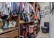 Large walk-in closet with custom wood shelving offering ample space for clothes, shoes, and accessories at 20109 W Madison St, Buckeye, AZ 85326