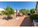 A well maintained desert landscaped backyard featuring mature trees and paver patio at 20632 N 103Rd Ave, Peoria, AZ 85382