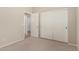 Bedroom featuring carpet flooring and a closet with sliding doors at 20632 N 103Rd Ave, Peoria, AZ 85382