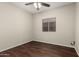 Bedroom featuring wood-look flooring and a ceiling fan with light at 20632 N 103Rd Ave, Peoria, AZ 85382
