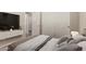Bright bedroom with neutral walls, comfortable bedding, and a modern wall-mounted media center at 20632 N 103Rd Ave, Peoria, AZ 85382