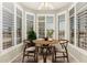 Charming breakfast nook surrounded by plantation shutters provides natural light and privacy at 20632 N 103Rd Ave, Peoria, AZ 85382