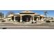 Exterior view of the clubhouse, featuring a well manicured landscape, parking and fountain at 20632 N 103Rd Ave, Peoria, AZ 85382