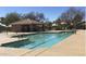 Community pool area with covered patio and lounge chairs for residents' relaxation at 20632 N 103Rd Ave, Peoria, AZ 85382