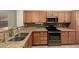 Kitchen features granite countertops, stainless steel appliances, and oak cabinetry at 20632 N 103Rd Ave, Peoria, AZ 85382
