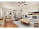 Spacious living room with a blend of neutral tones, stylish decor, and comfortable seating options at 20632 N 103Rd Ave, Peoria, AZ 85382