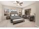 Calm main bedroom features a cozy bed, and neutral tones that create a relaxing retreat at 20632 N 103Rd Ave, Peoria, AZ 85382