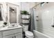 Well-lit bathroom with granite counters, a shower-tub combo, and a decorative plant shelf, offering modern amenities at 2090 S Dorsey Ln # 1019, Tempe, AZ 85282