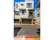 Modern townhouse exterior featuring garages, balconies, and stylish design, offering an upscale living experience at 2090 S Dorsey Ln # 1019, Tempe, AZ 85282