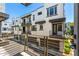Stylish townhome exterior with balconies and modern design, offering a blend of indoor-outdoor living spaces at 2090 S Dorsey Ln # 1019, Tempe, AZ 85282
