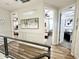 Bright hallway with a view of multiple bedrooms, modern railings, and neutral wall colors at 2090 S Dorsey Ln # 1019, Tempe, AZ 85282