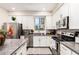 Modern kitchen with stainless steel appliances, gray countertops and white cabinetry at 2090 S Dorsey Ln # 1019, Tempe, AZ 85282