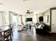 Bright living room features a ceiling fan, hardwood floors, and sliding door access to an outdoor patio at 2090 S Dorsey Ln # 1019, Tempe, AZ 85282