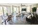 Bright and airy living room with large windows, hardwood floors and a ceiling fan at 2090 S Dorsey Ln # 1019, Tempe, AZ 85282