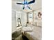Comfortable main bedroom with a bathroom en suite, stylish fan, and natural light at 2090 S Dorsey Ln # 1019, Tempe, AZ 85282