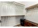 Walk-in closet with ample storage space, shelving, wooden rods, and a chest of drawers for organizing clothes at 2090 S Dorsey Ln # 1019, Tempe, AZ 85282
