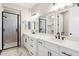 Beautiful bathroom featuring double sinks, white cabinets and glass shower at 2249 N Shannon Way, Mesa, AZ 85215