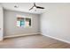 Bedroom with modern ceiling fan and window offering natural light at 2249 N Shannon Way, Mesa, AZ 85215