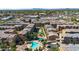 An aerial view of a vibrant community featuring a pool, playground, and sand volleyball court at 240 W Juniper Ave # 1020, Gilbert, AZ 85233