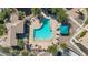 Aerial view of a community pool featuring a pool-house, shade pavilion and lounge chairs at 240 W Juniper Ave # 1020, Gilbert, AZ 85233