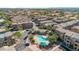 An aerial view of a well maintained community showcasing a lovely pool at 240 W Juniper Ave # 1020, Gilbert, AZ 85233