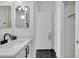 Bright bathroom showcases a modern vanity with black hardware and stylish black and white flooring at 240 W Juniper Ave # 1020, Gilbert, AZ 85233