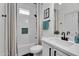 Chic bathroom features a shower with decorative curtain, white tile, and modern fixtures at 240 W Juniper Ave # 1020, Gilbert, AZ 85233
