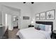 Comfortable bedroom offering a glimpse into the stylish bathroom with black and white tile at 240 W Juniper Ave # 1020, Gilbert, AZ 85233